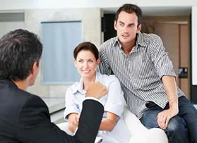 Couple talking to yacht broker