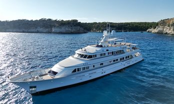 Charter yacht GENESIA at anchor in a bay